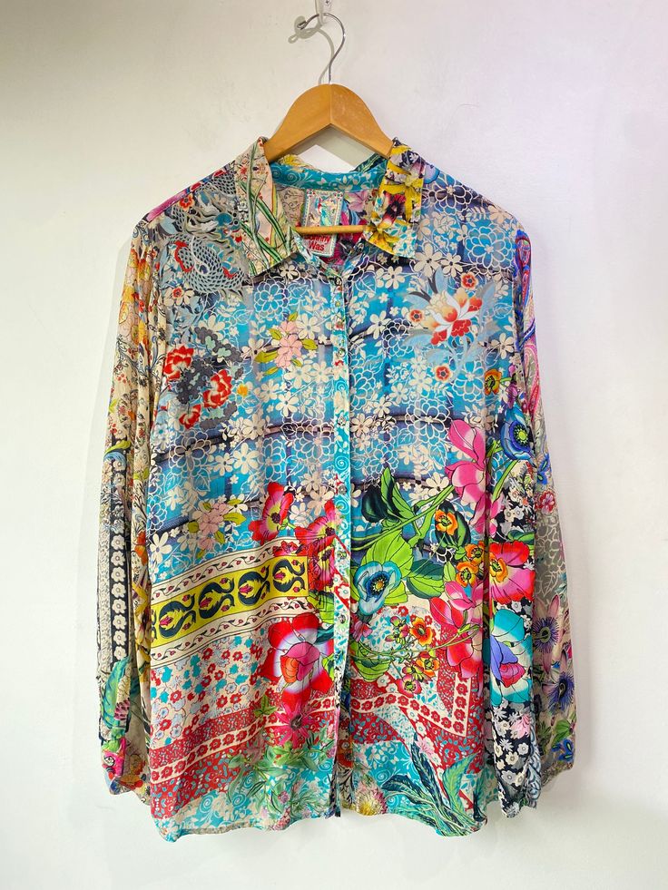 Johnny Was Floral Print Top! Has long sleeves, a classic collar, and buttons up the front. 100% rayon. Size large, please refer to measurements. In excellent condition! Approx. Measurements: Underarm to Underarm: 22" Sleeve Length: 25" Length: 29.5" Silk Long Sleeve Shirt With Floral Print, Silk Shirt With Floral Print And Long Sleeves, Multicolor Silk Shirt For Spring, Multicolor Print Long Sleeve Silk Blouse, Silk Long Sleeve Multicolor Print Blouse, Multicolor Print Silk Long Sleeve Blouse, Silk Long Sleeve Blouse In Multicolor Print, Multicolor Long Sleeve Relaxed Fit Blouse, Multicolor Print Long Sleeve Silk Top