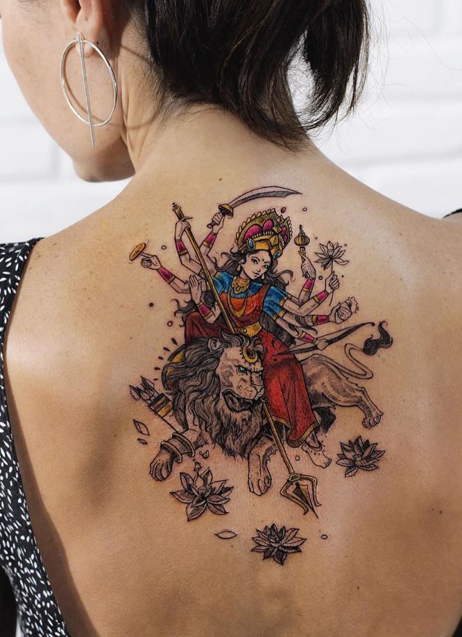 a woman with a tattoo on her back