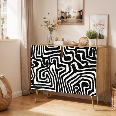 a black and white cabinet in a living room