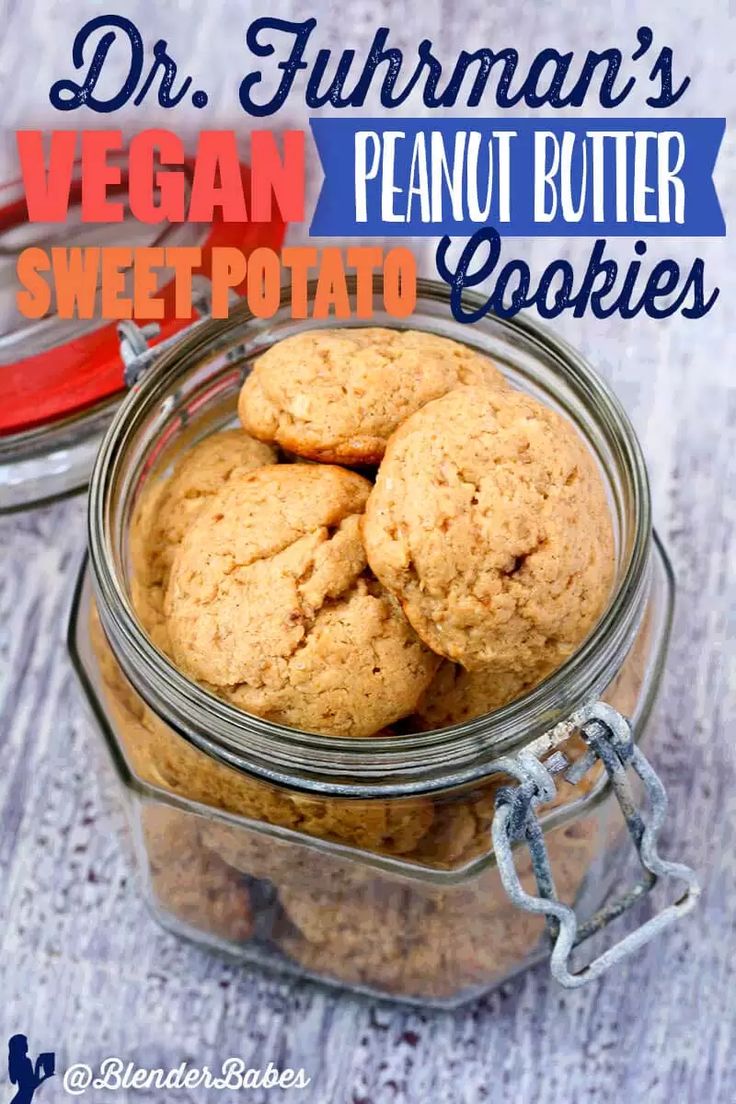 vegan peanut butter cookies in a glass jar on a wooden table with text overlay