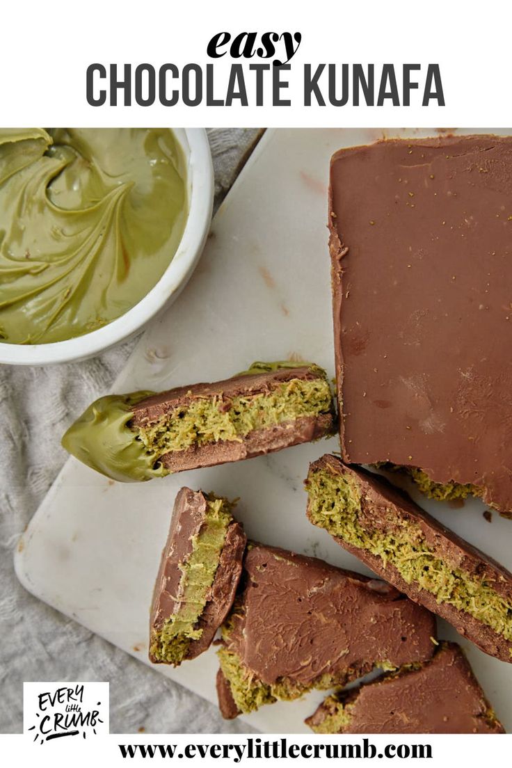 chocolate kunnafa is cut in half on a cutting board next to a bowl of green sauce