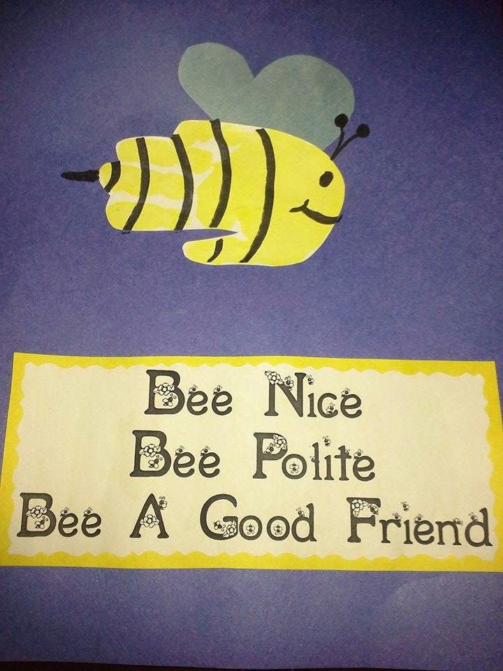 a bee is flying over a sign that says be nice bee pollite bee a good friend