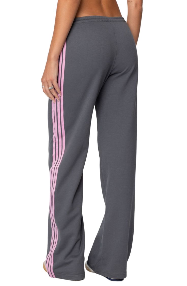 Sporty stripes trail the sides of these wide-leg cotton-blend sweatpants topped with a comfortable elasticized drawstring waist. Elastic/drawstring waist 50% cotton, 50% polyester Machine wash, dry flat Imported Athleisure Cotton Sweatpants With Three Stripes, Cotton Athleisure Sweatpants With Three Stripes, Athleisure Relaxed Fit Pants With Three Stripes, Athleisure Pants With Three Stripes In Relaxed Fit, Athleisure Jogging Bottoms With Contrast Stripes, Sporty Loungewear Bottoms With Side Stripes, Sporty Loungewear Pants With Side Stripes, Sporty Relaxed Fit Sweatpants With Contrast Stripes, Sporty Sweatpants With Contrast Stripes, Relaxed Fit