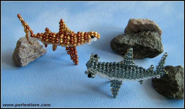 three different types of beaded objects sitting next to each other on a blue surface