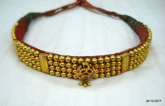 Vintage antique tribal old 22kt gold beads choker necklace from rajasthan India. Great design good for jewelry collection.Note - Gold beads are filled with wax. Please check pictures carefully for more detail.Groos weight - 73.5 gramsNet gold weight approx - 24 gramsGold beads length - 26.7 cm (10.5 inches)Gold beads width - 2 cm (0.8 inches)Length free size can be adjsut by back thread knot. Dholki Beads Necklace Gold, Thushi Necklace Gold Designs, Ceremonial Temple Jewelry Choker With Intricate Design, Traditional Kundan Choker Necklace With Intricate Design, Traditional Kundan Choker With Intricate Design, Traditional Kundan Choker Necklace For Ceremonial Occasions, Antique Gold Temple Necklace With Tilla For Festivals, Festival Antique Gold Temple Necklace With Tilla, Ceremonial Traditional Kundan Choker Necklace