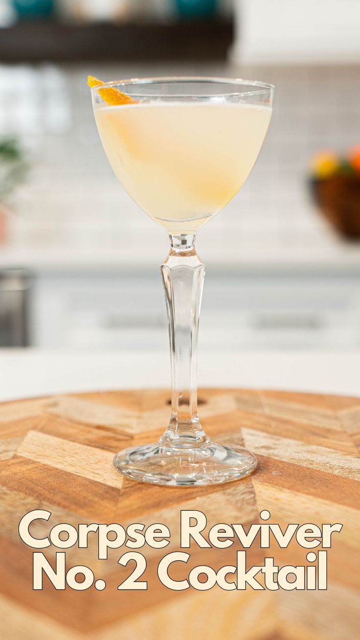 a close up of a drink on a table with the words corpse reviver no 2 cocktail