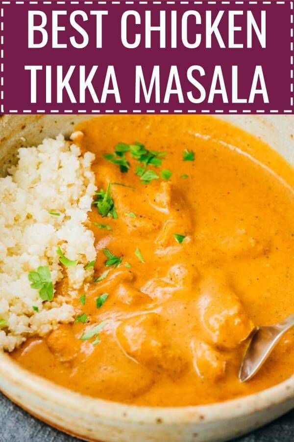 the best chicken tikka masala in a bowl with rice and garnish