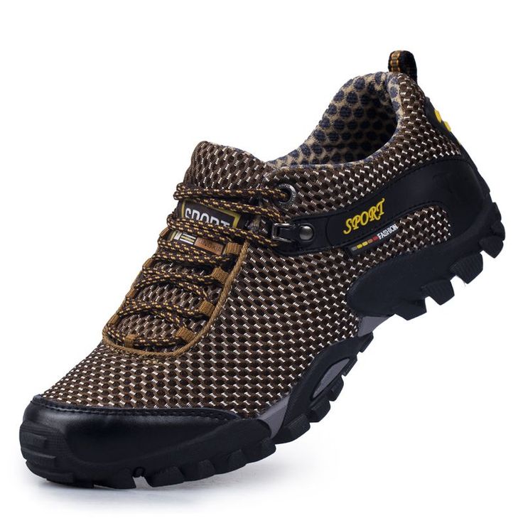 a brown and black sneaker shoe with the word moto written on it