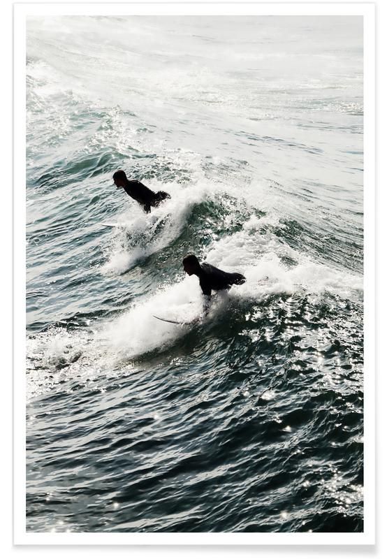 two dogs are surfing on the waves in the ocean, one is black and white