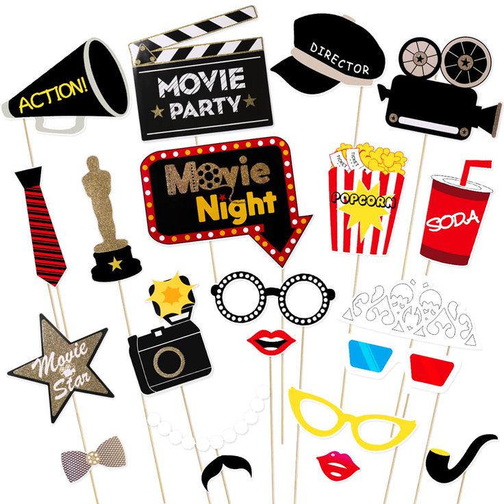 a bunch of party photo props on a stick with the words movie night written in it