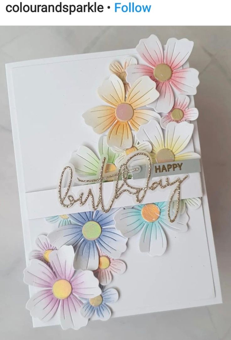 a card with flowers and the words happy on it