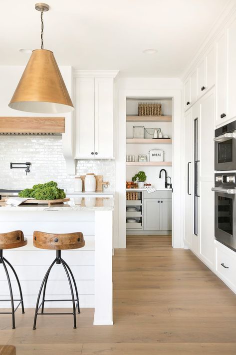 two stools are in front of the kitchen island