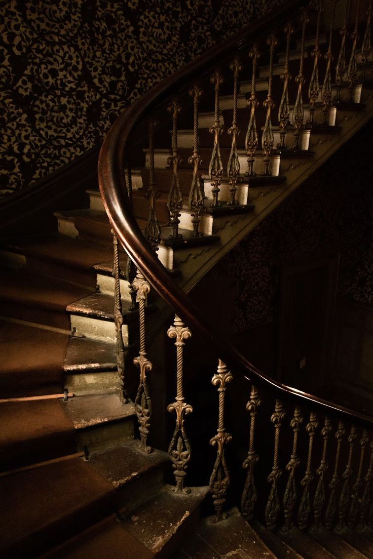 an old staircase with candles on it