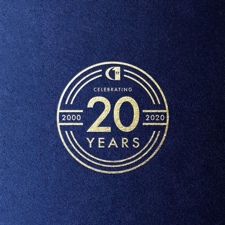 the logo for celebrating 20 years is shown in gold on a dark blue paper background