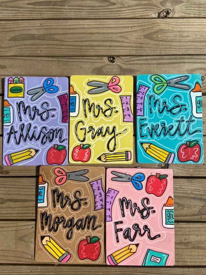 four different colored notebooks with the words mrs and mr and mrs fair written on them