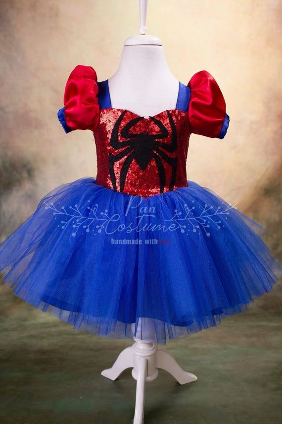 a red, blue and black spiderman tutu dress on a mannequin