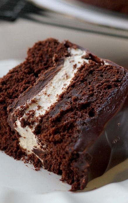 a piece of chocolate cake with white frosting