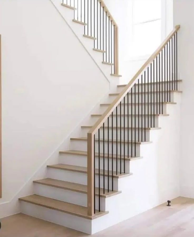 there is a white stair case in the room