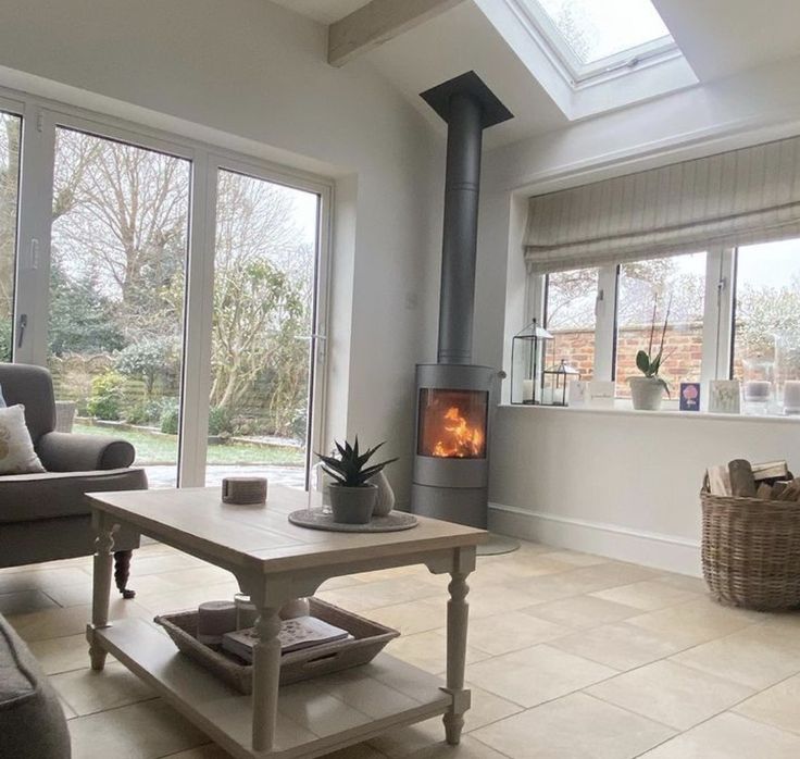 a living room filled with furniture and a fire place