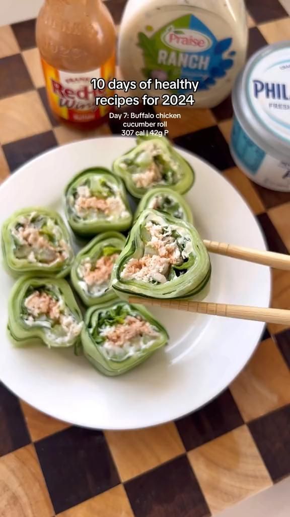 some food on a plate with chopsticks and mayonnaise next to it