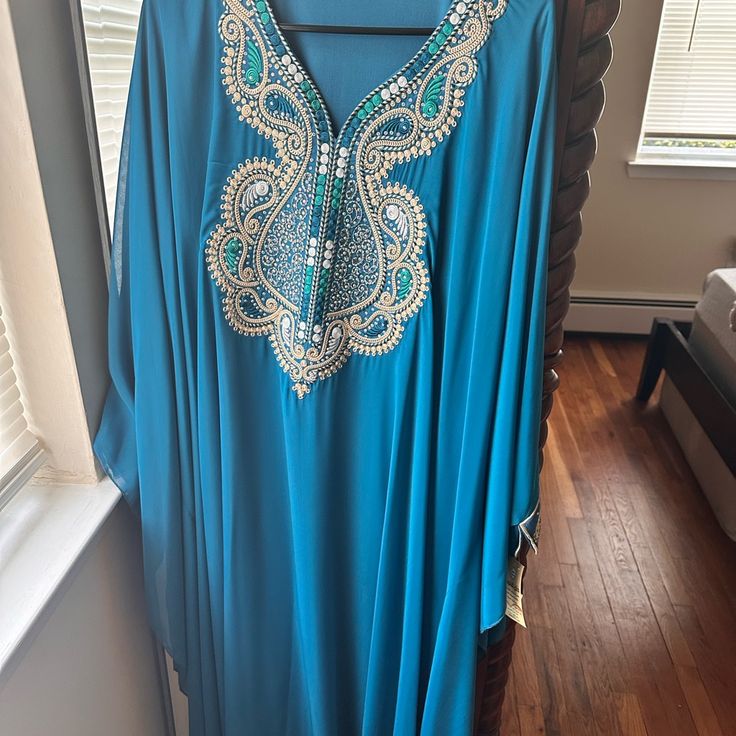 It’s Beautiful Abaya Brand New Never Used Elegant Blue Long Sleeve Abaya, Elegant Long Sleeve Blue Abaya, Blue Evening Abaya For Eid, Festive Blue Abaya For Party, Blue Formal Thobe For Eid, Blue Long Sleeve Abaya For Party, Festive Blue Party Abaya, Elegant Blue Abaya For Party, Formal Blue Floor-length Abaya