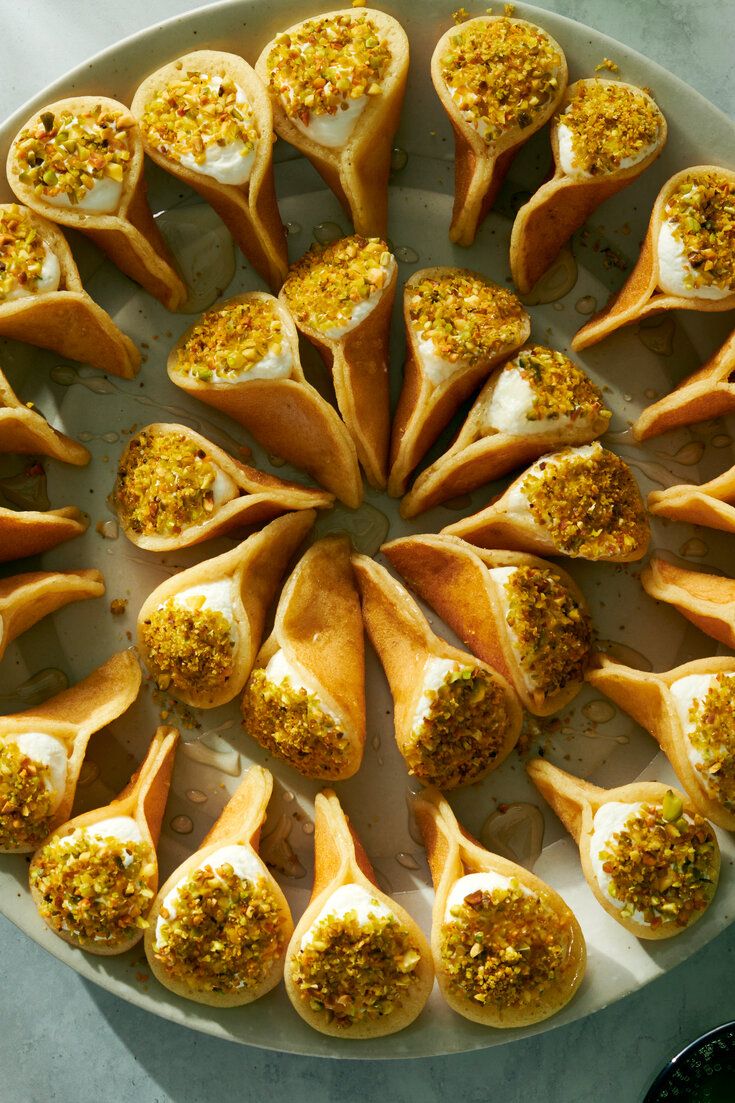 a platter filled with different types of appetizers on top of a table