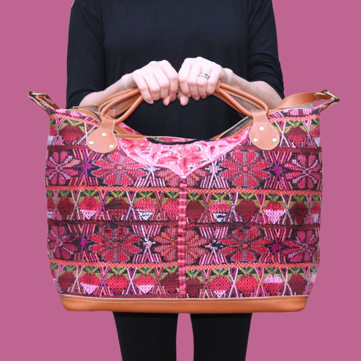 Take a break with Intertwined's stylish Huipil Weekender! This unique travel bag is made from an upcycled huipil – a traditional Mayan handwoven blouse – and is sure to be the talk of the town. Our partner's leather workshop in Guatemala transforms the huipil into a gorgeous bag, and with their attention to detail, you can be sure this artisan bag will be around for many trips to come! Bon voyage! Travel Woven Satchel, Artisan Handwoven Travel Satchel, Artisan Handwoven Satchel For Travel, Bohemian Ethically Sourced Shoulder Bag For Travel, Rectangular Travel Bag With Weaving Work, Traditional Handwoven Satchel For Travel, Traditional Woven Satchel For Travel, Brown Weekender Bag For Trip, Woven Travel Tote Bag