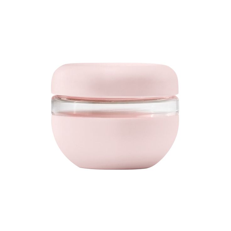 a pink glass jar with a lid on a white background