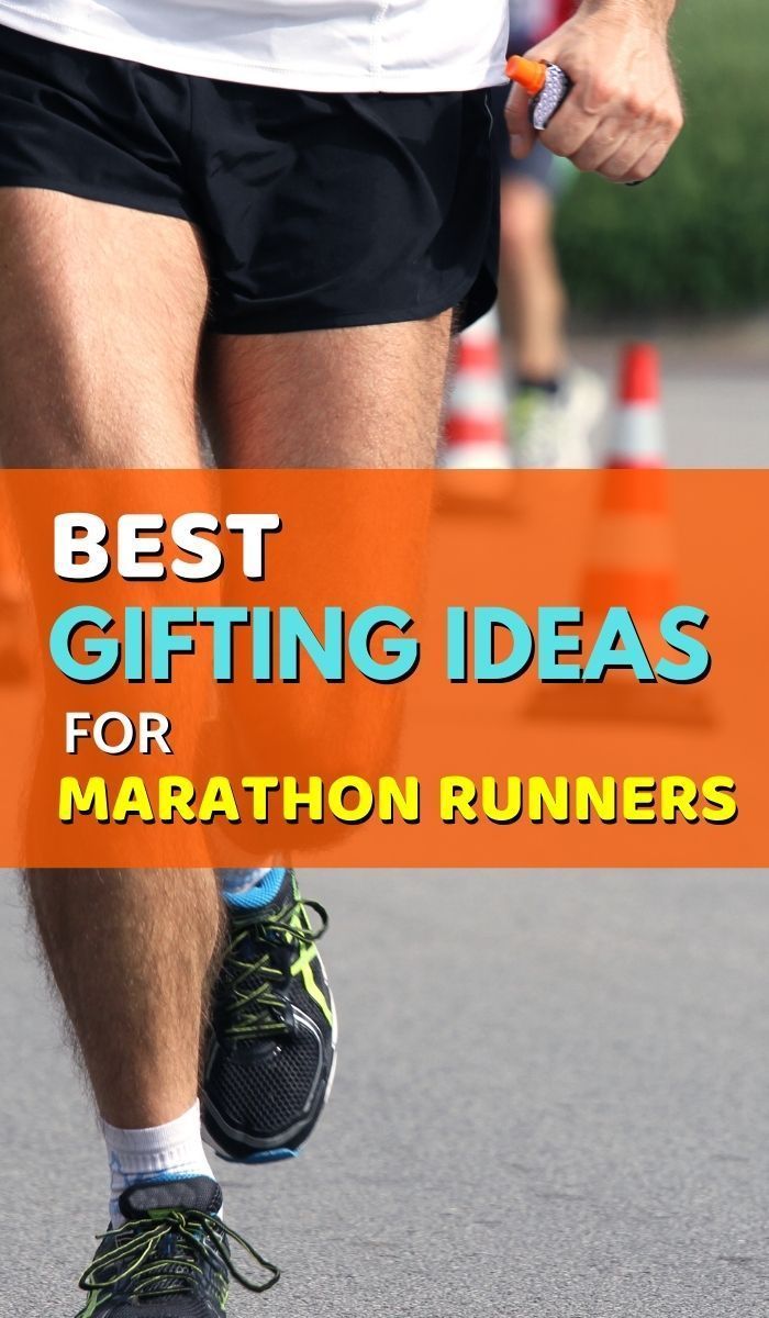 a man is running on the road with an orange sign that says best gift ideas for marathon runners