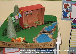 a cake made to look like a boxcar child's play house and pond