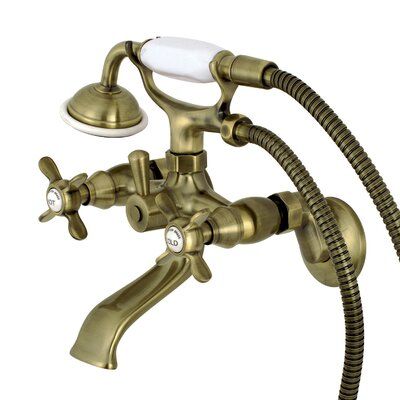 a faucet with two hoses attached to it and a white light on the side