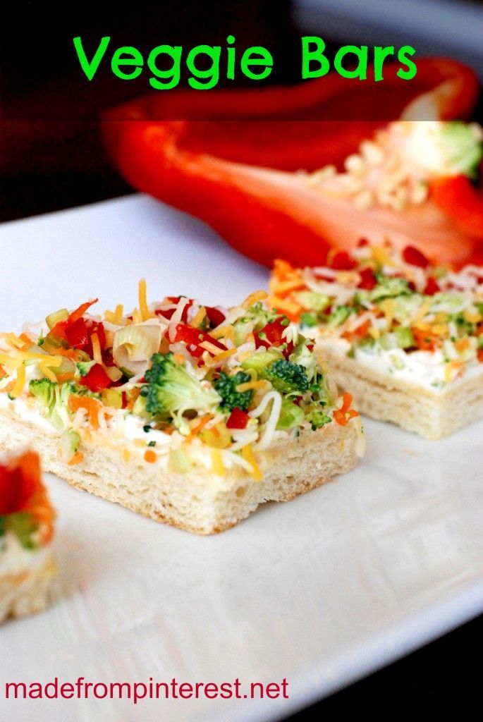 vegetable bars on a white plate with tomatoes and broccoli in the background text reads veggie bars