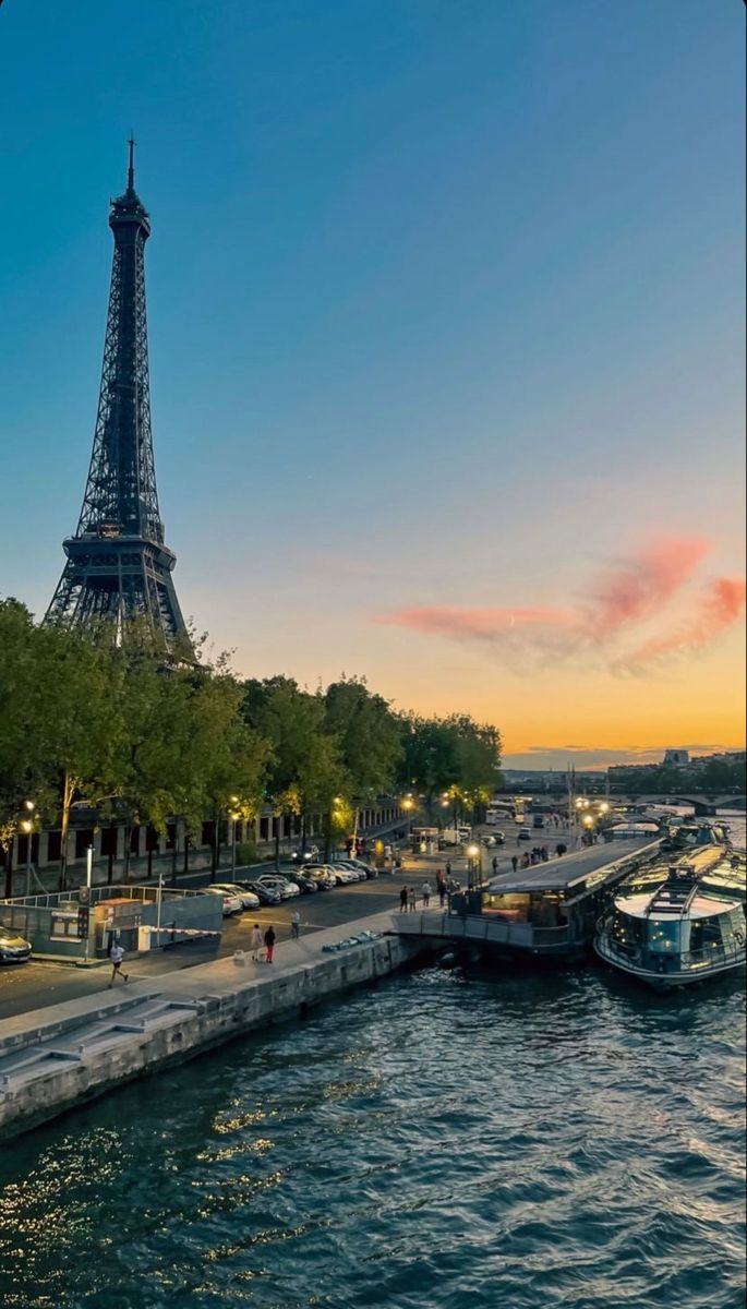 the eiffel tower towering over the city of paris, france at sunset or dawn