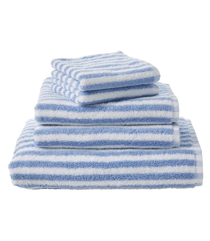 blue and white towels stacked on top of each other