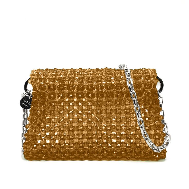 Introducing the Maxi Roma, a stunning medium shoulder bag that effortlessly combines style and functionality. Handcrafted with meticulous attention to detail, this bag features a maxi size design, perfect for all your essentials. Made from high-quality crystal beads, it exudes an air of luxury and sophistication.The unlined interior provides a minimalist aesthetic while offering ample space to fit your essentials. Material: Crystals beads Unlined Height: 13 cm Width: 21 cm Depth: 6 cm Complete with a 1-meter chain Made in: Italy Fit Notes:It's the perfect size to carry your iPhone, wallet, keys, earphones, and lipsticks.Designed and handcrafted in Italy, this exquisite piece features silver or gold hardware, allowing you to customize your look. The Maxi Roma bag offers versatility and conv Crystals Beads, Crystal Bags, Minimalist Aesthetic, Iphone Wallet, Gold Hardware, Crystal Beads, Yellow Gold, Thing 1, Shoulder Bag