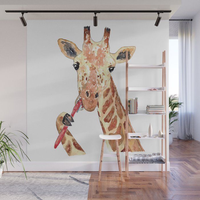 a giraffe eating from a red object in its mouth wall mural print