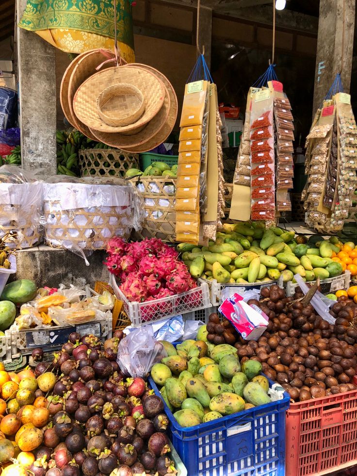 various fruits and vegetables are on display in baskets