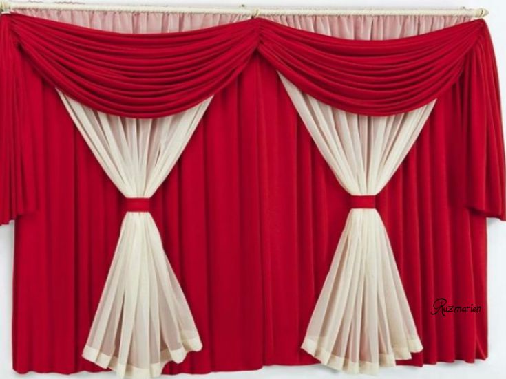 red and white curtains hanging on the side of a wall