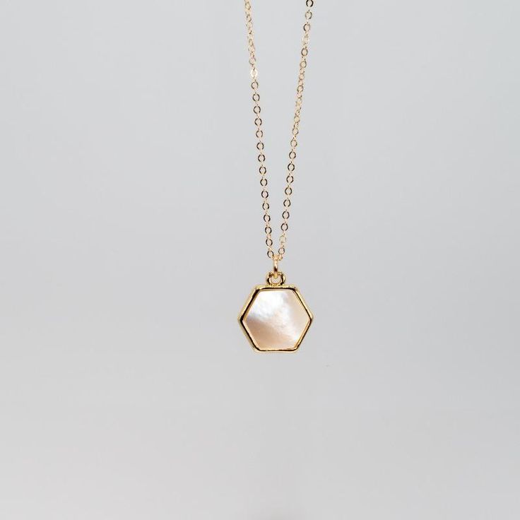 Hexagon shaped gemlets are electroplated in recycled brass with 24K gold overlay and hang delicately from a 14K gold filled 18" chain. 10mm Stone. Offered in a variety of stones that embrace and emit healing properties. Check out a stone encyclopedia here. Minimalist Faceted Octagon Jewelry, Minimalist Octagon Faceted Jewelry, Minimalist Brass Necklace With Gemstone, Minimalist Brass Gemstone Necklace, Gold Elegant Charm Necklaces For Healing, Minimalist Hexagon Faceted Jewelry, Hexagon Faceted Necklace For Gifts, Hexagon Faceted Necklace For Gift, Hexagonal Gemstone Necklace As Gift