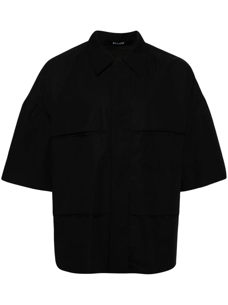 black cotton pointed flat collar concealed front fastening drop shoulder short sleeves two chest patch pockets straight hem Black Tops With Welt Pockets And Spread Collar, Black Top With Welt Pockets And Spread Collar, Black Cotton Shirt With Concealed Placket, Black Collared Top With Flap Pockets, Black Collared Tops With Flap Pockets, Black Collared Top With Side Pockets, Modern Collared Shirt With Patch Pockets, Black Collared Top With Welt Pockets, Black Collared Tops With Patch Pockets