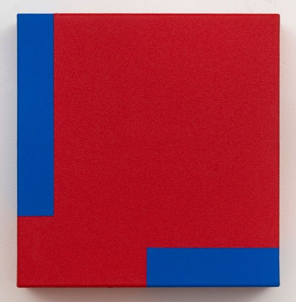 a red and blue painting on a white wall