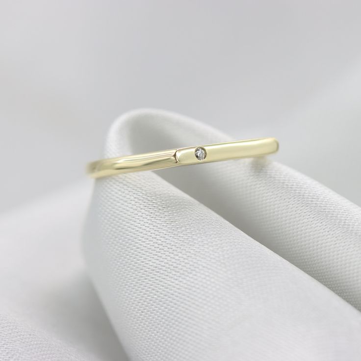 "A Perfect stacking Diamond bar ring set with a single diamond in 14K or 18K gold. A ring that is both Dainty and elegant, Simple and unique. Handmade by an inspired jewelry artist team with decades of experience in the craft of jewelry making. Each gemstone, each diamond is carefully picked. Using only the finest raw materials and the highest industry standard in manufacturing, design and finish. A beautiful vintage inspired piece handmade just for you. Ring Features: - Single Diamond 1.25 mm, Classic Yellow Gold Diamond Ring With Simple Design, Gold Midi Rings With Single Diamond For Anniversary, Gold Midi Ring With Single Diamond For Anniversary, Simple Round Band Diamond Anniversary Ring, Minimalist Initial Ring With Bezel Setting For Anniversary, Minimalist Diamond Ring With Accents, Minimalist Stackable Diamond Ring For Formal Occasions, Simple Gold Diamond Ring For Anniversary, Simple Yellow Gold Diamond Ring As Gift