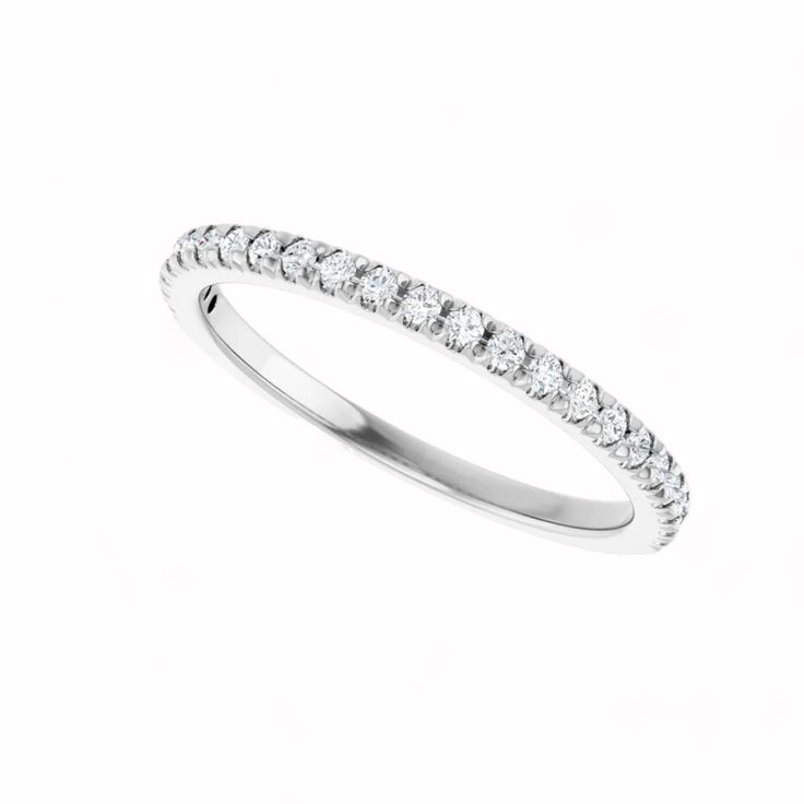 Elysium Black Diamond - RHEA RING Named after the goddess of motherhood and fertility, the Rhea Anniversary Band embodies nurturing elegance and timeless beauty. Crafted from luxurious 14k White Gold, this band features 23 lab-grown diamonds, each 1.3 mm in size, meticulously set to create a harmonious and radiant design. With a total carat weight of 1/4 CTW, the diamonds boast SI2-SI3 clarity and G-I color, offering a perfect blend of brilliance and sophistication. RING DETAILS:14k White Gold1/ Classic Eternity Band With Halo For Gift, Classic Eternity Band With Halo Detail As A Gift, Classic Eternity Band With Halo As A Gift, Formal White Gold Stackable Rings With Halo Design, Classic White Eternity Band With Halo, Timeless White Gold Bands With Brilliant Cut, Classic White Halo Eternity Band, Classic Stackable Rings With Halo Design, White Gold Halo Eternity Band For Promise Ring