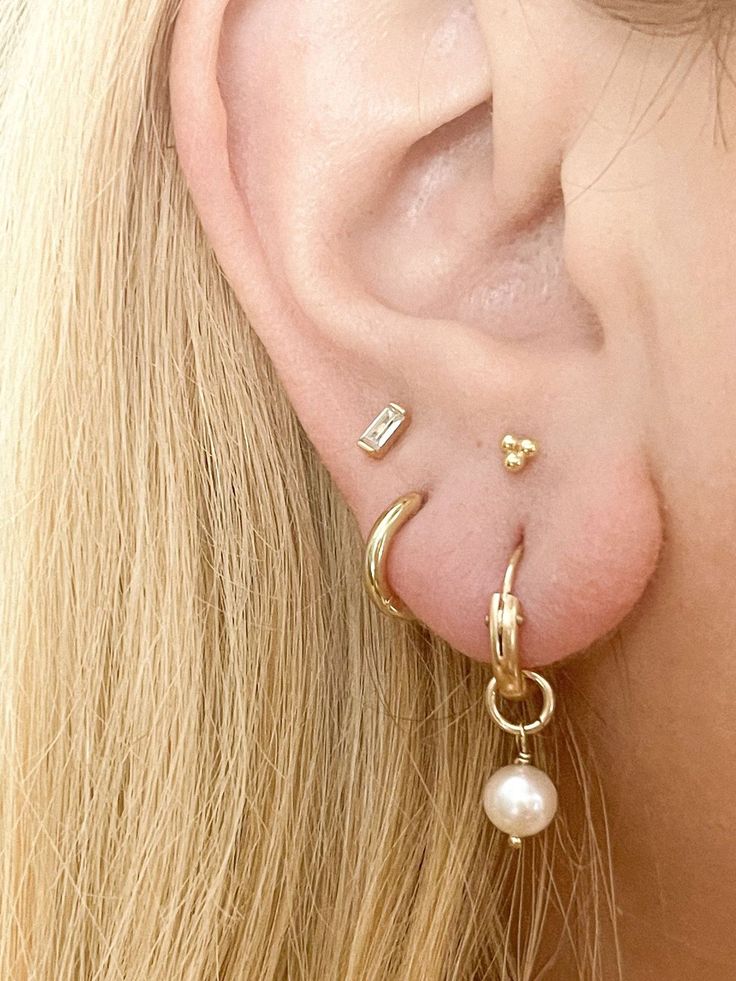 The perfect everyday earrings- now with genuine freshwater pearls! Our lightweight huggie hoop earrings measure about 12mm and are so comfortable, you'll never want to take them off! These simple beauties will never tarnish and can live life with you! 14k gold-filled hoops (pair) 6-7mm freshwater pearls Nickel Free, Hypoallergenic, and Lightweight Measures 12mm and made to gently hug your ear Signature Gift Packaging Included Everyday 14k Gold Hoop Earrings With Pearl Charm, 14k Gold-filled Huggie Hoop Earrings With Pearl Charm, 14k Gold Huggie Hoop Earrings With Pearl Drop, Everyday Pearl Charm Huggie Jewelry, Everyday Huggie Jewelry With Pearl Charm, Everyday Gold Huggie Pearl Earrings, Minimalist Pearl Charm Hoop Earrings For Everyday, Everyday Hoop Earrings With Pearl Charm, Dainty Pearl Charm Huggie Earrings