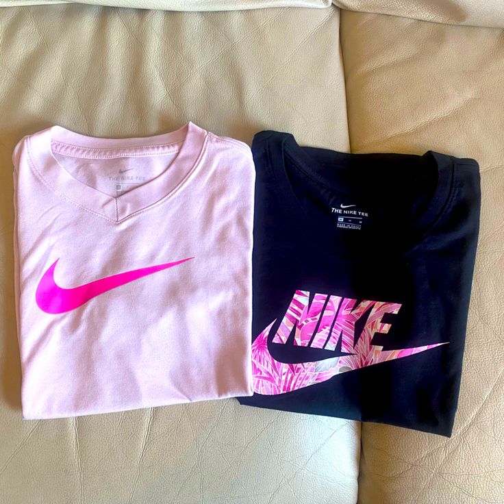 Girl’s Nike Shirts Pink Shirt Is Size Small Black Is Size Medium, Bnwt Nike Pink Tops With Letter Print, Pink Nike Tops With Letter Print, Nike Pink Crew Neck Top, Nike Pink Top With Logo Print, Nike Pink T-shirt With Graphic Print, Pink Logo Print Shirt For Spring, Spring Pink Shirt With Logo Print, Casual Pink Nike Shirt, Kids Nike