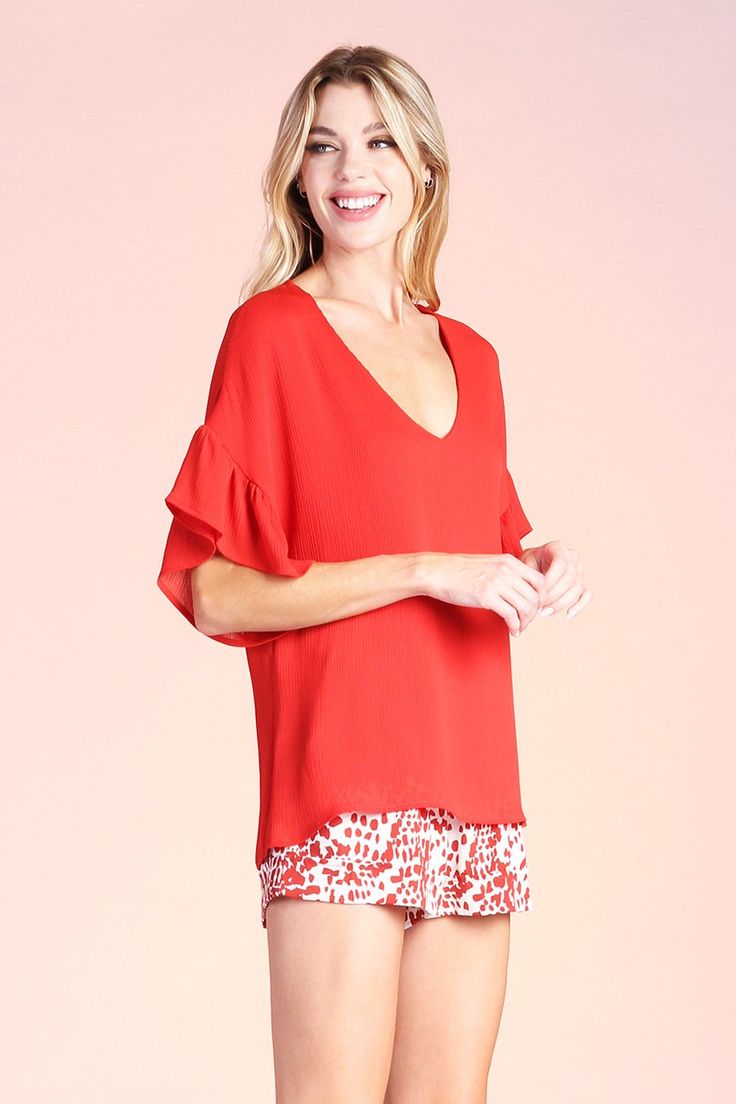 V neckline Short sleeves Ruffle detail on sleeves Chiffon-like crinkle textured fabric Lined 100% Polyester SKU #: T-6989 Relaxed Fit V-neck Top With Ruffles, Chic V-neck Top For Spring Brunch, Casual Short Sleeve V-neck Top For Brunch, Feminine V-neck Top With Ruffle Hem, Summer Rayon V-neck Tops, Chic Relaxed Fit V-neck Top For Day Out, Relaxed Fit V-neck Tops For Brunch, Vacation Viscose V-neck Tops, V-neck Blouse With Ruffle Hem For Vacation