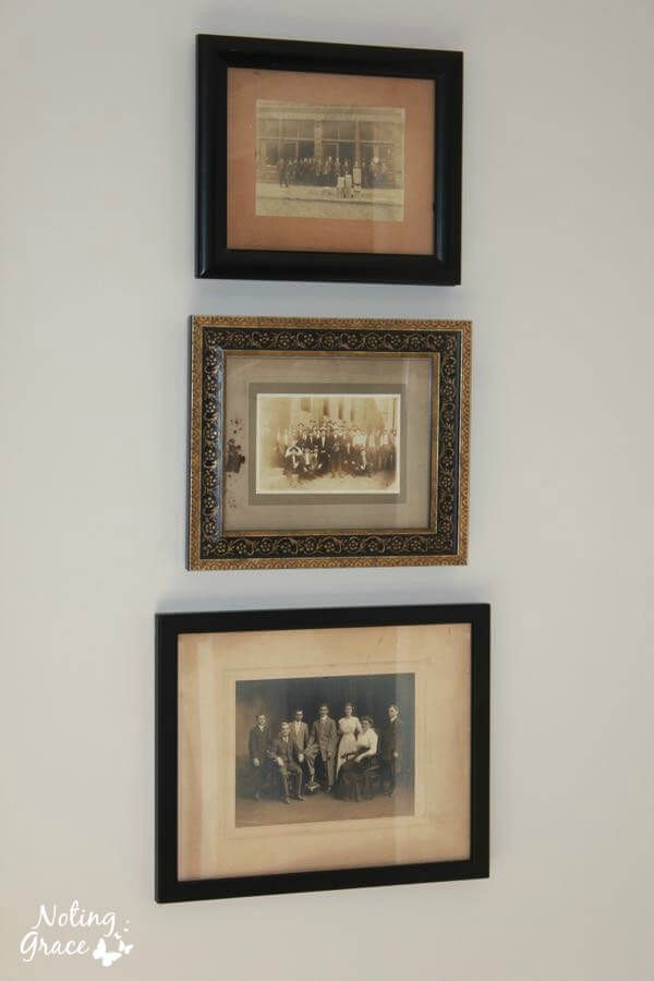 three framed photographs hang on the wall