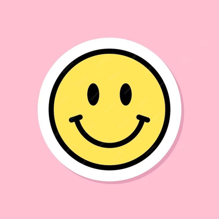 a yellow smiley face on a pink background