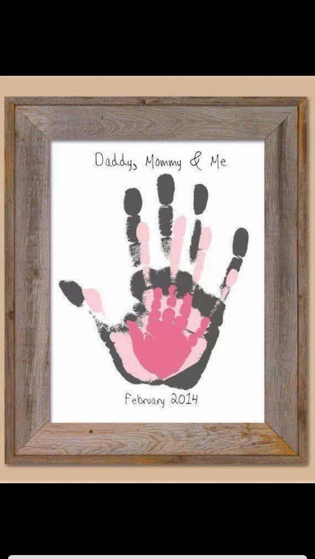 a handprint is displayed in a frame with the words daddy's mommy and me