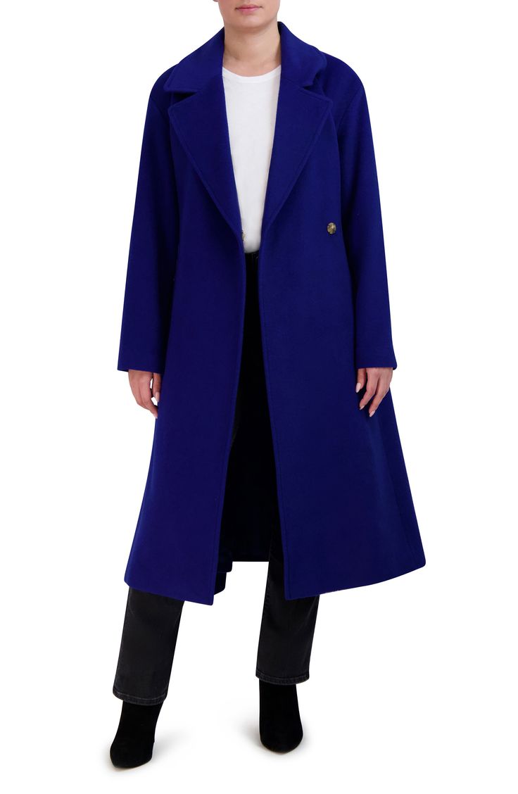 Crafted from a lightweight-but-toasty wool blend, this coat features handsome notched lapels and a timeless longline silhouette. 45" length Front snap closure Notched lapels Side pockets Removable tie belt Lined 52% wool, 47% polyester, 1% other fibers Dry clean Imported Blue Wool Coat, Blue Winter Coat, Chic Coat, Longline Coat, Wrap Coat, Oversized Coat, Wool Blend Coat, Trench Coats Women, Blue Wool